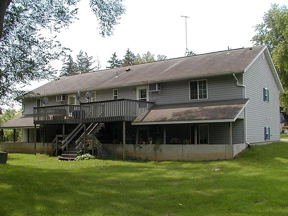 Park-like back yard with covered patio