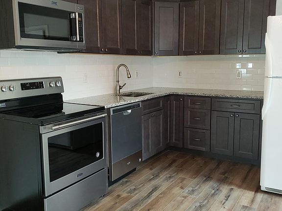 New kitchen with new cabinets, countertops, appliances and f