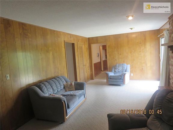 Rec Room w/ Masonry Fireplace and Walk Out Sliding Door