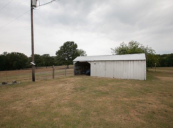 Fenced yard with storage