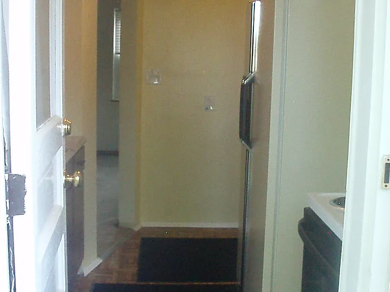 Entering kitchen from the side patio. All mats and rugs stay on site, unless you would like to use one of your own. (let landlord know if you would like to do this on any)