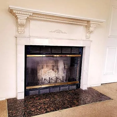 Natural Wood Fireplace with Granite Base and Marble Mantel
