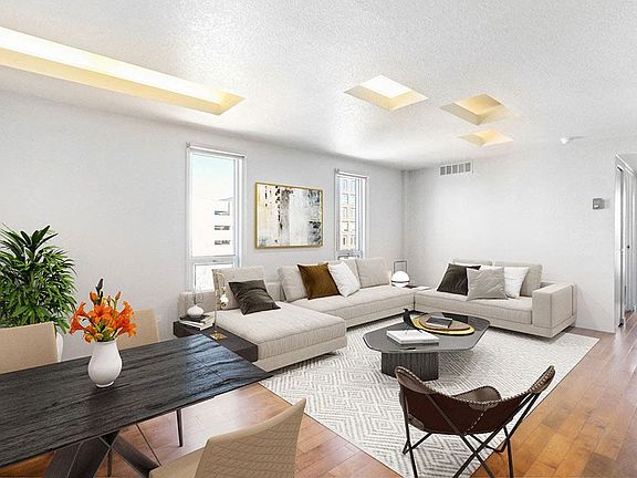 Modern bright-white living space with hardwood flooring