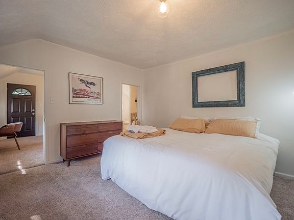 Spacious primary bedroom with en suite bath.