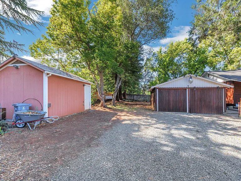 Two-car garage and room for an RV, Boat, or trailer on the side. Power for the RV on the Pink Unit.