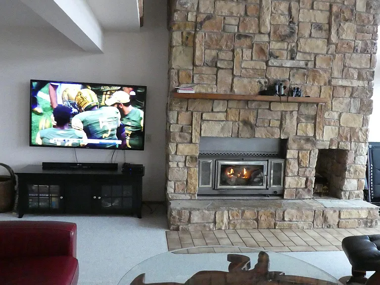 Large screen TV on swivel.