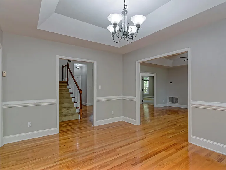 dining room next to kitchen on one side and great room on the other