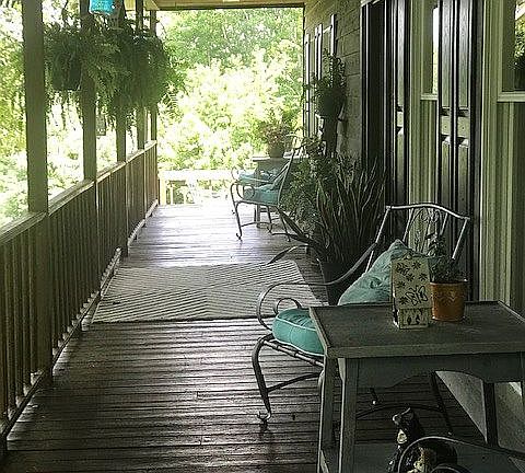 Porch leads to covered deck