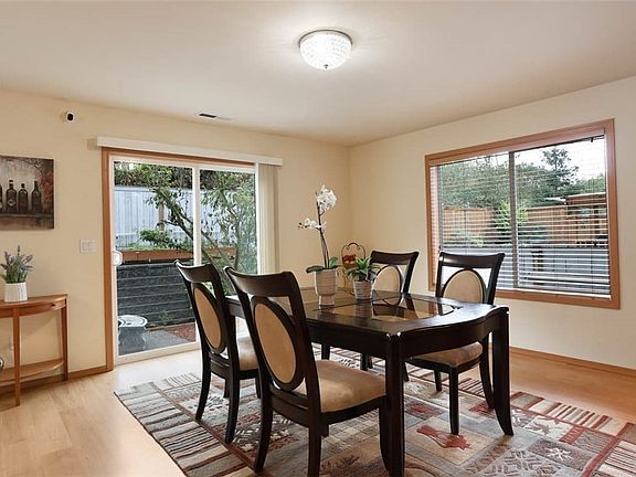 Dining area with sliding door access to backyard.