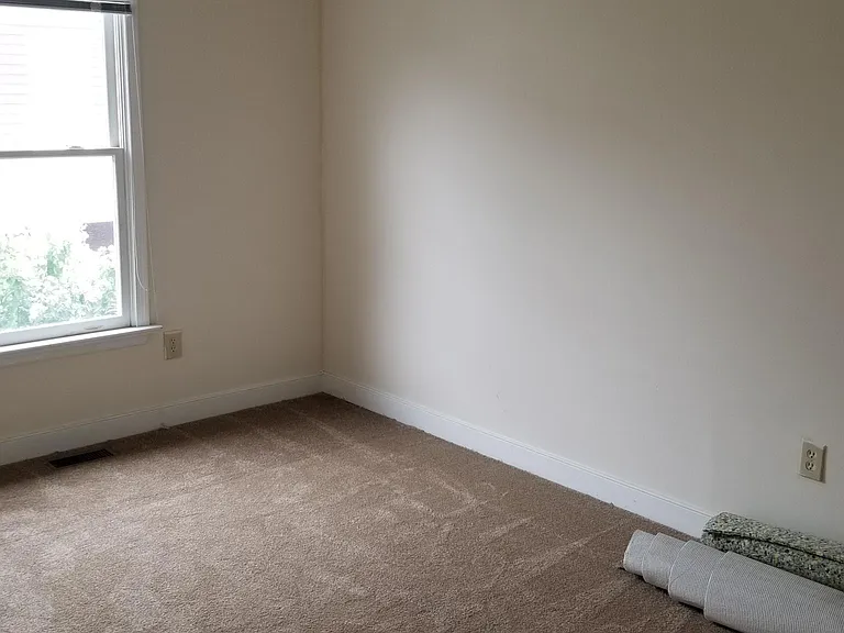 One of the upstairs bedrooms after new carpet installed.