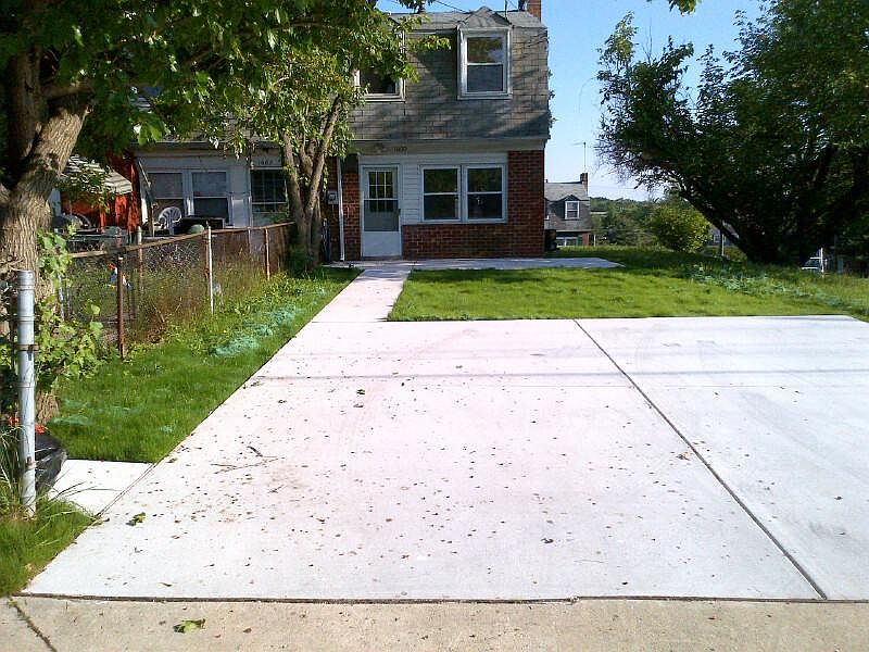 Off street parking pad for two cars with convenient rear entrance