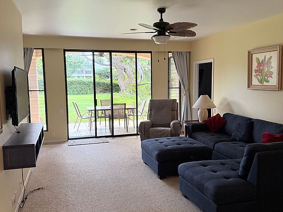 Living room looking to lanai and second fairway