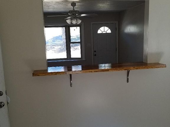 Lovely Kitchen Pass-Through with Bar Top