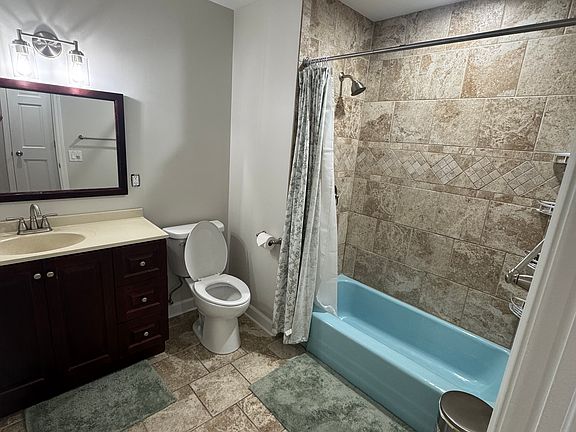 Shared bathroom with tub/shower