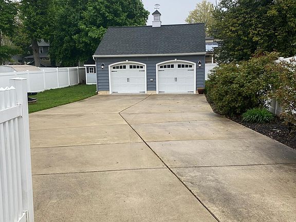 Backyard. One of of detached garage is included in lease.