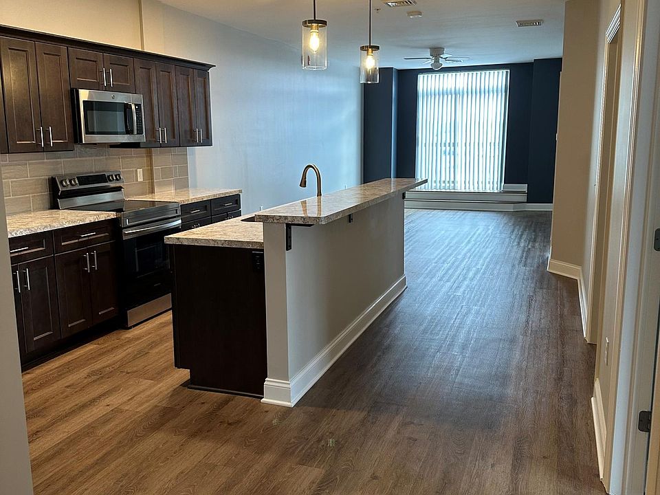 Kitchen and living area w/ balcony