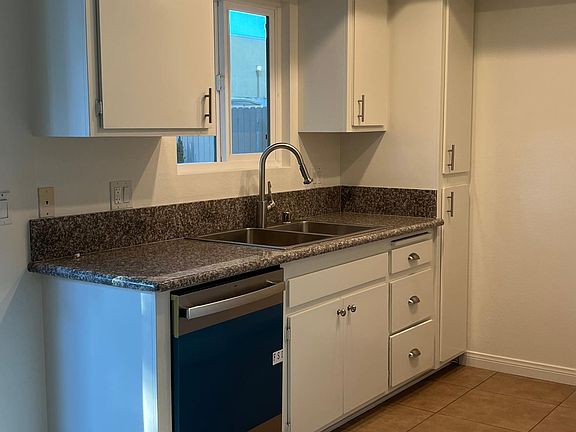 Upgraded kitchen, new appliances, countertops, kitchenette, slider to large private backyard