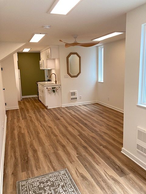 Studio living space with easy to maintain vinyl flooring throughout
