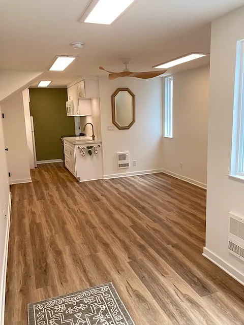 Studio living space with easy to maintain vinyl flooring throughout