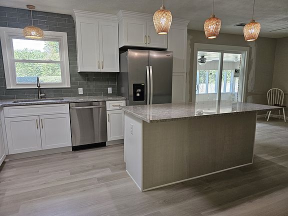 6ft Island with cabinets, drawers and bar space for stools.