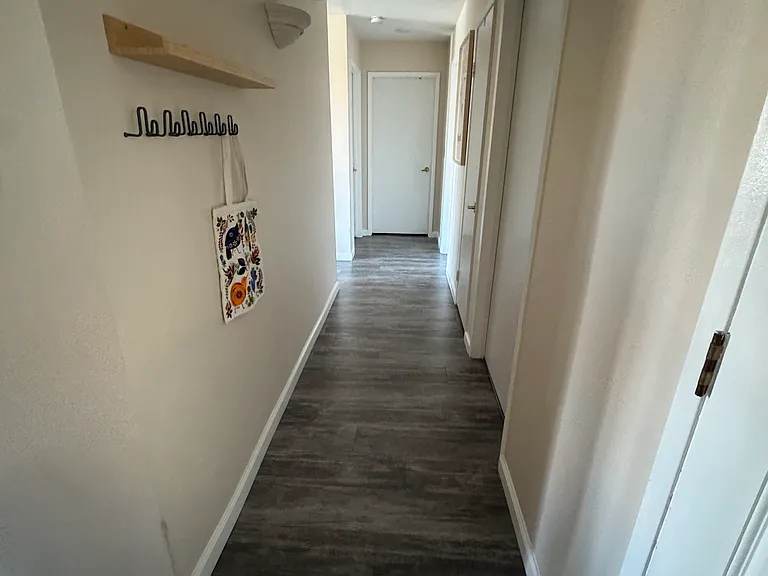 Immediately looking right upon entering front door.
