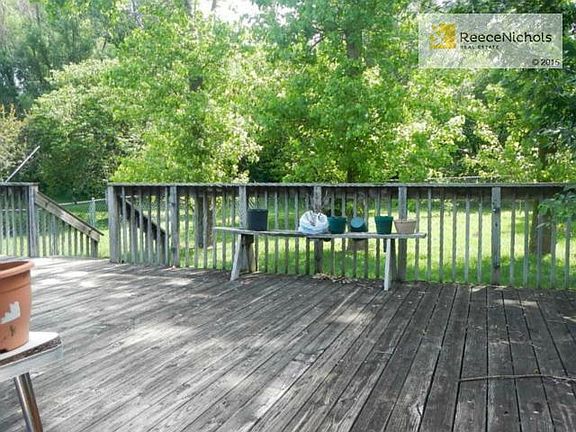 Great sized deck overlooks 3/4 acre lot with fruit trees