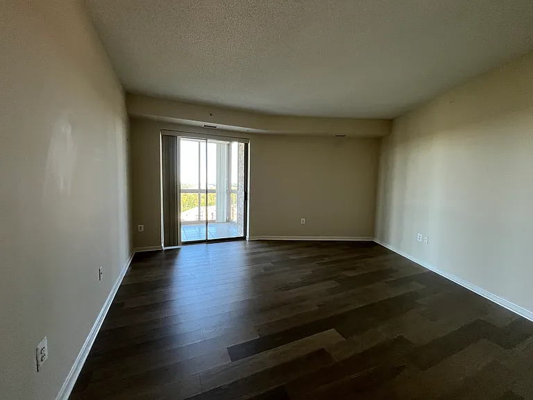 Primary bedroom with sliding glass door to balcony
