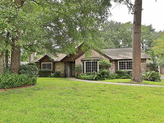 Beautiful landscaping and curb appeal with gorgeous mature trees.