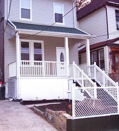 Front with fence and porc