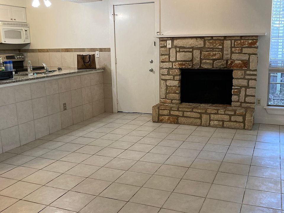 LIVING ARE WITH FIREPLACE AND OPEN TO KITCHEN