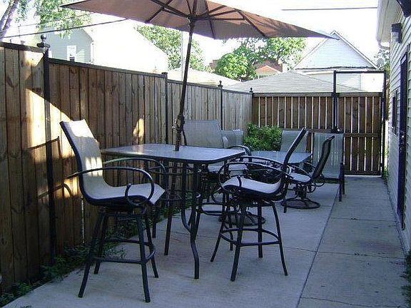 Privacy fenced backyard . Includes a grill and sound system