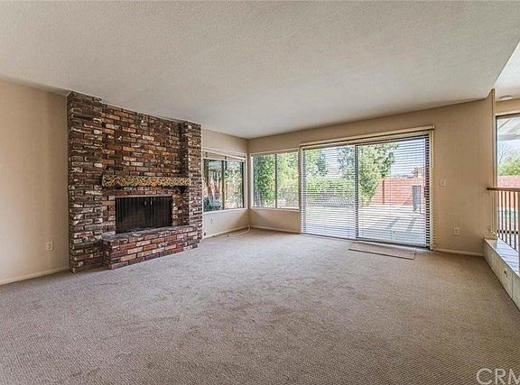 Family Room with brick fireplace and wetbar