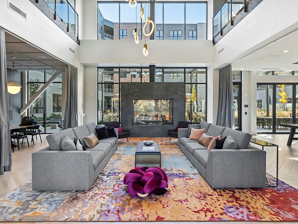 Double-height living room with indoor/outdoor fireplace