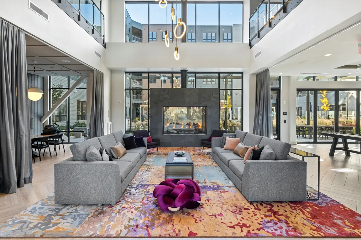 Double-height living room with indoor/outdoor fireplace