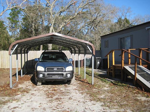 Carport & SW side of home