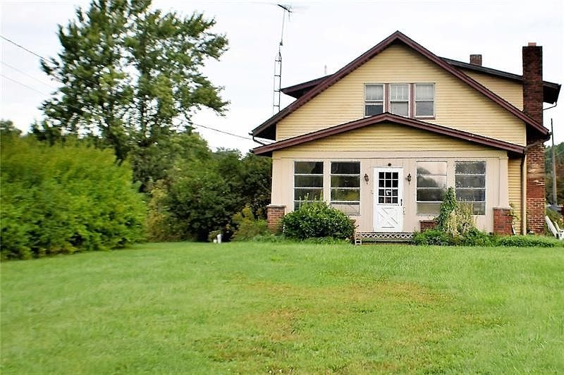 One Acre Level Lot in Laurel School District.  Bring this farmhouse back to life!
