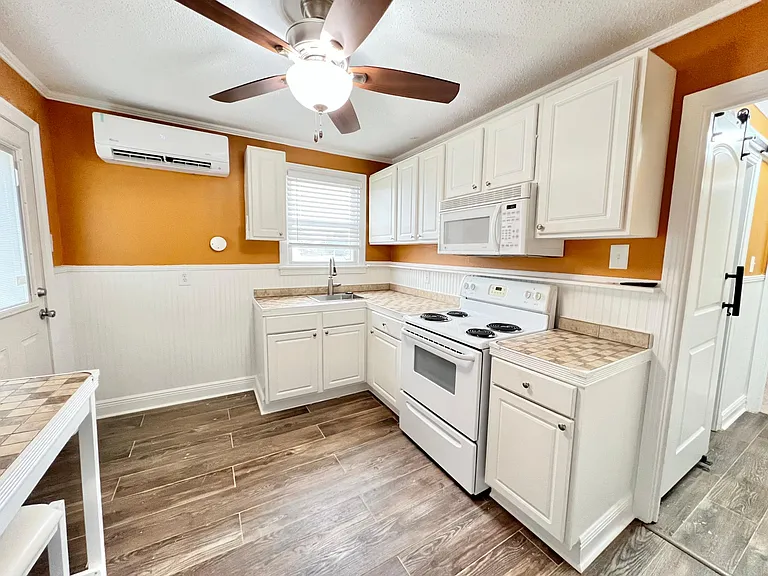 Built in energy efficient AC, microwave and ceiling fan.