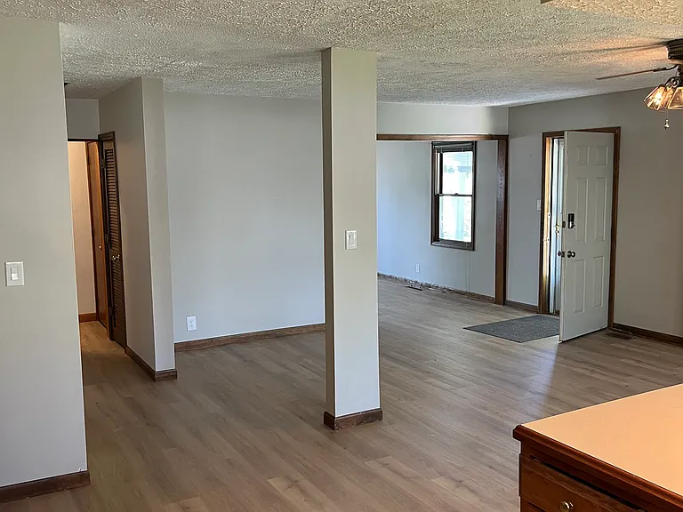 Common areas, hallway entrance on left, carport entrance on right.