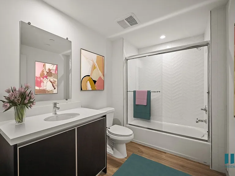 Spacious Bathroom with Shower Bath with a Glass Door and Vanity Cabinet Storage - Pear Floor Plan