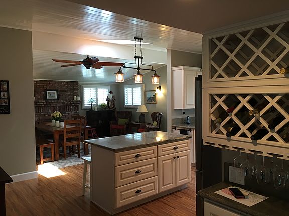 Turnkey home with built-in wine rack, gourmet kitchen and mo