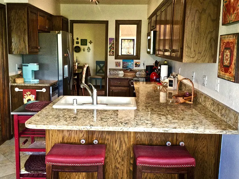 This kitchen is small, but efficient! None of the appliances are older than 3 years. (Except the trash compactor, which is a working antique.)