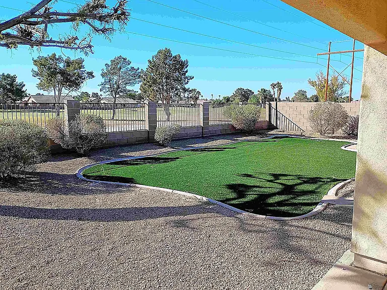 Back yard with gate to Golf Corse