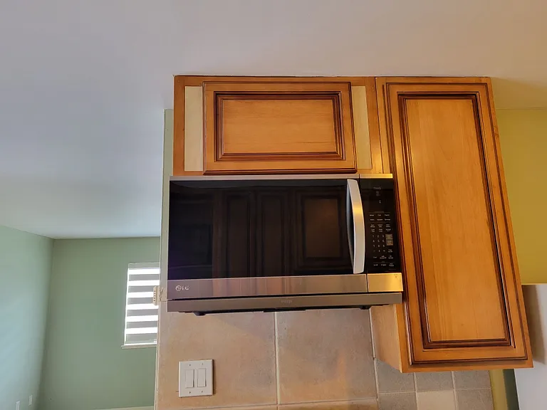 New Microwave with push vent that comes out over stove. I have the same one at my home. It works really nice.