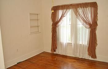 One of the 3 bedrooms has wood floors.