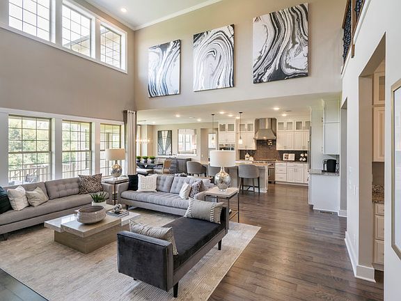 Two story gathering room with large windows