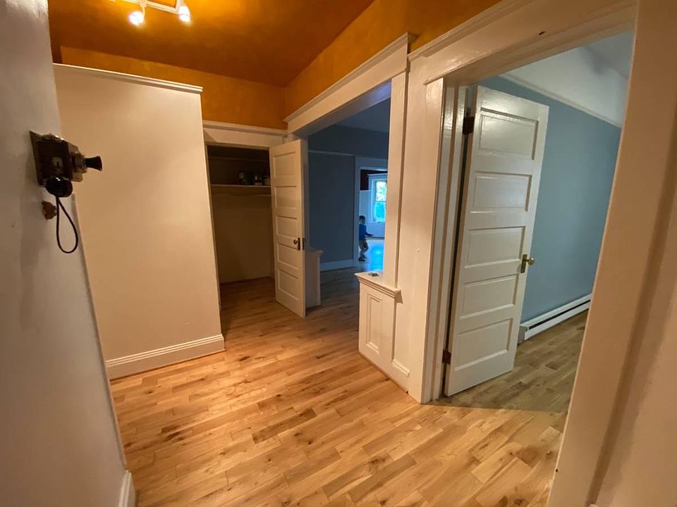 Entrance to condo, looking into closet, living room and first bedroom.
