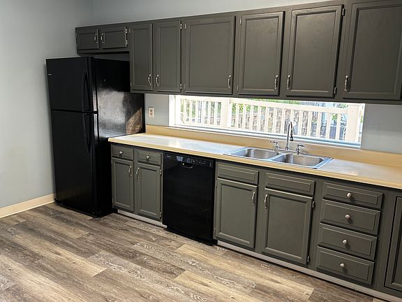 Kitchen with more cabinet space than you need. Beautiful unique window above counter. New dishwasher and fridge.
