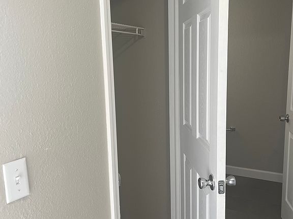 Coat storage in hall immediately to the left