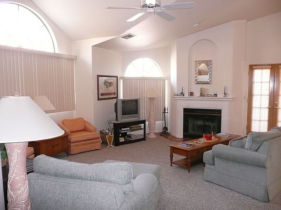Living Room w/ Vaulted Ceiling & Fireplace