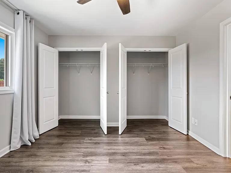 Spacious primary bedroom with two generous closets.